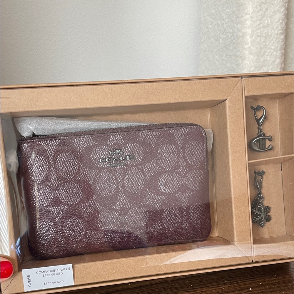 Coach wine metallic signature canvas wristlet with charms NEW in BOX